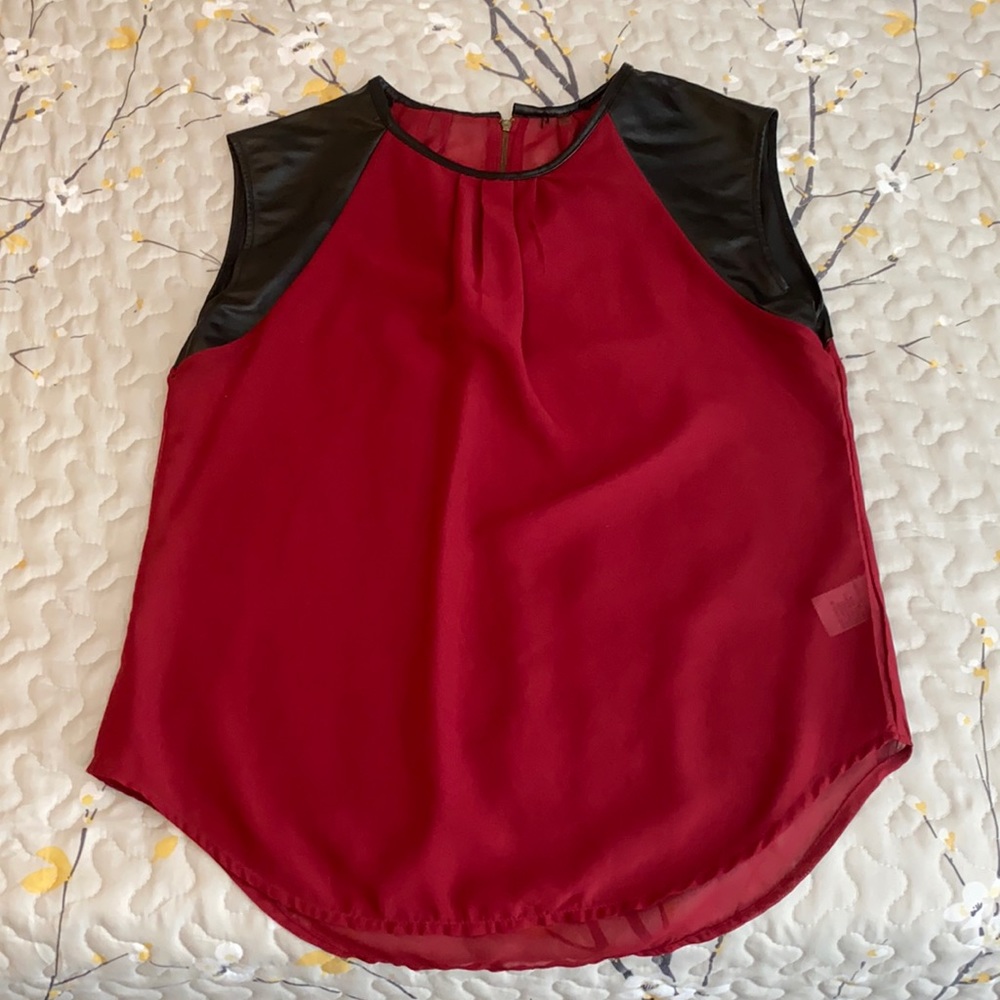 Sheer Garnet color shirt with faux leather sleeves. Size S